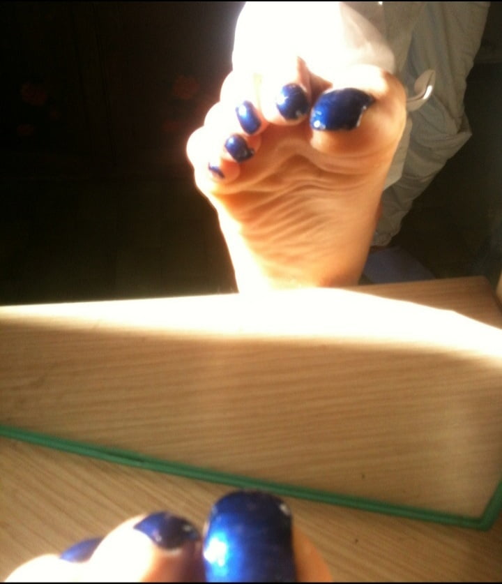 Blue toenails under sun ray #106845619