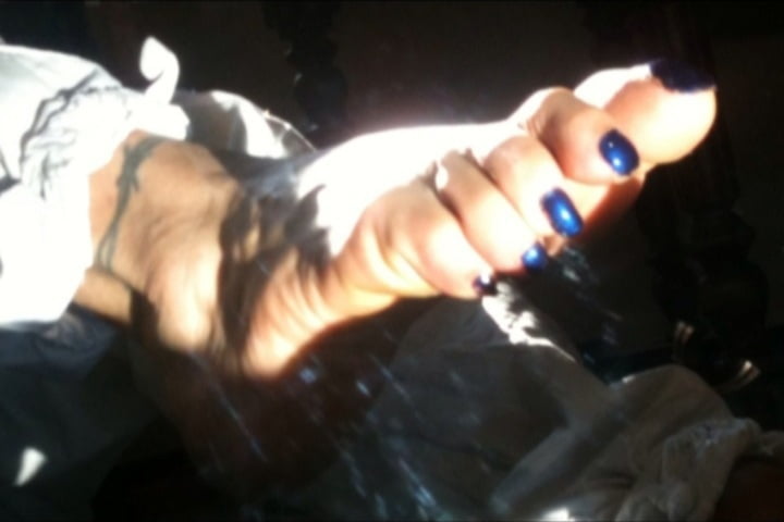 Blue toenails under sun ray #106845627