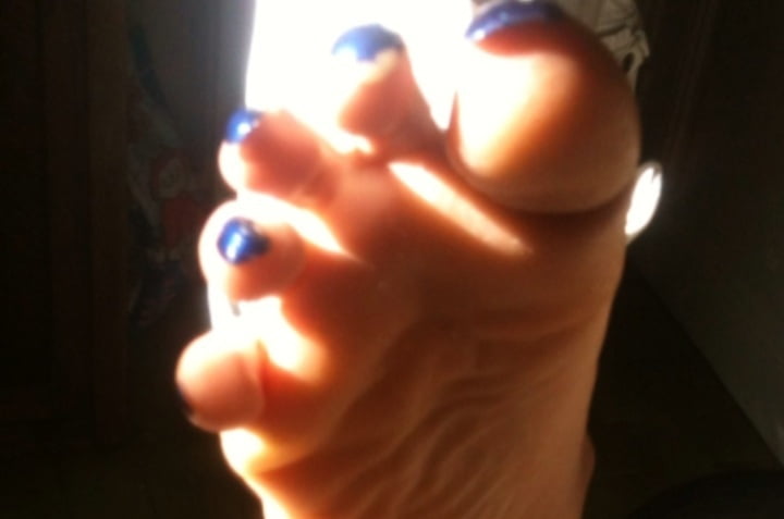 Blue toenails under sun ray #106845658