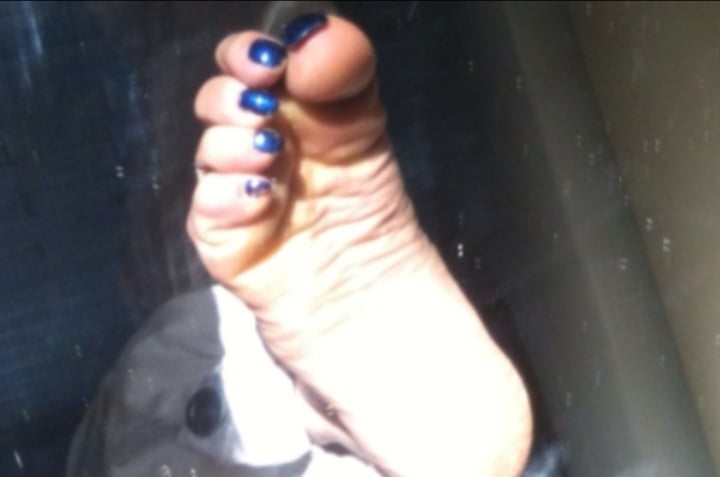 Blue toenails under sun ray #106845667
