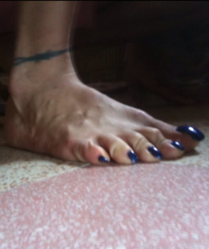 Blue toenails under sun ray #106845674