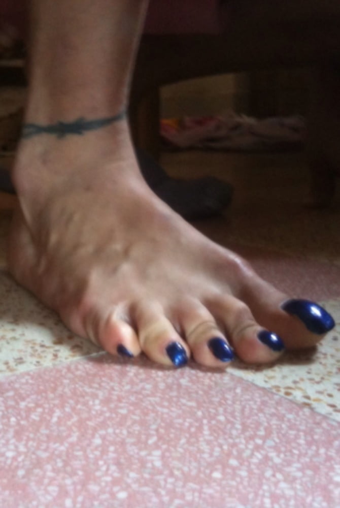 Blue toenails under sun ray #106845675