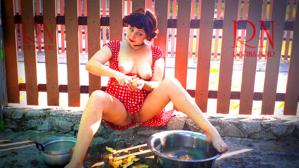 Retro maid prepares potatoes for dinner. Vintage performance #106580463