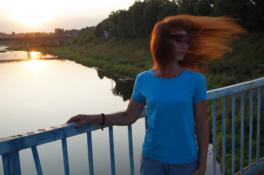 Flamehair in evening on the bridge #107247460