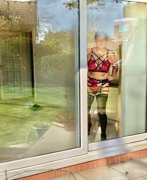 Matures standing in front of window 8 #92933314