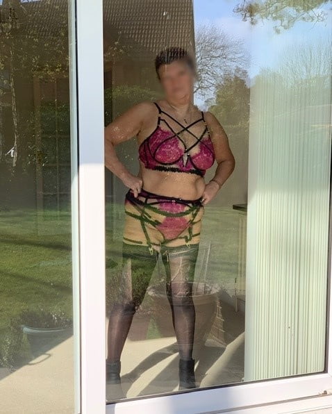 Matures standing in front of window 8 #92933316