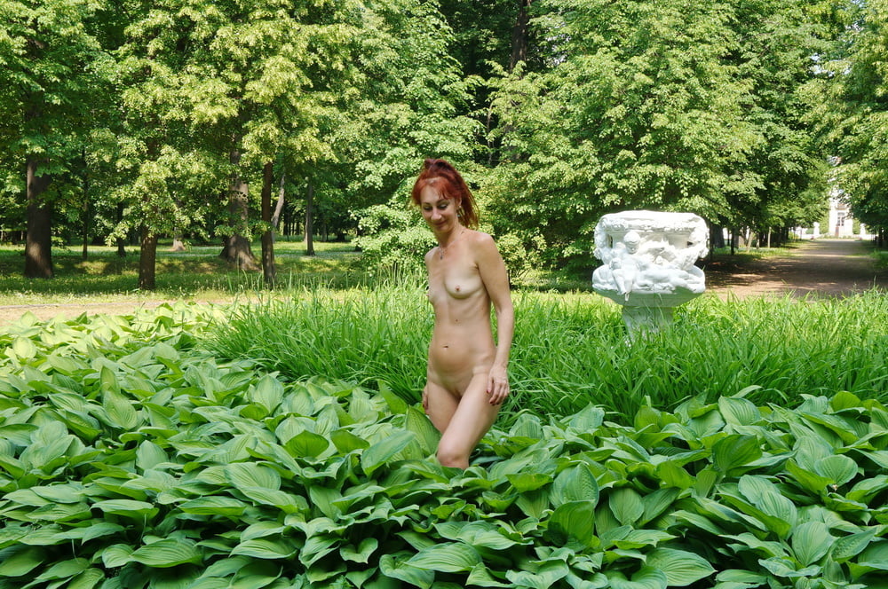 Naked in the grass by the vase #106992954