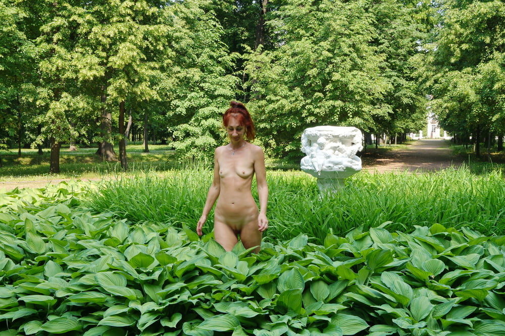 Naked in the grass by the vase #106992956