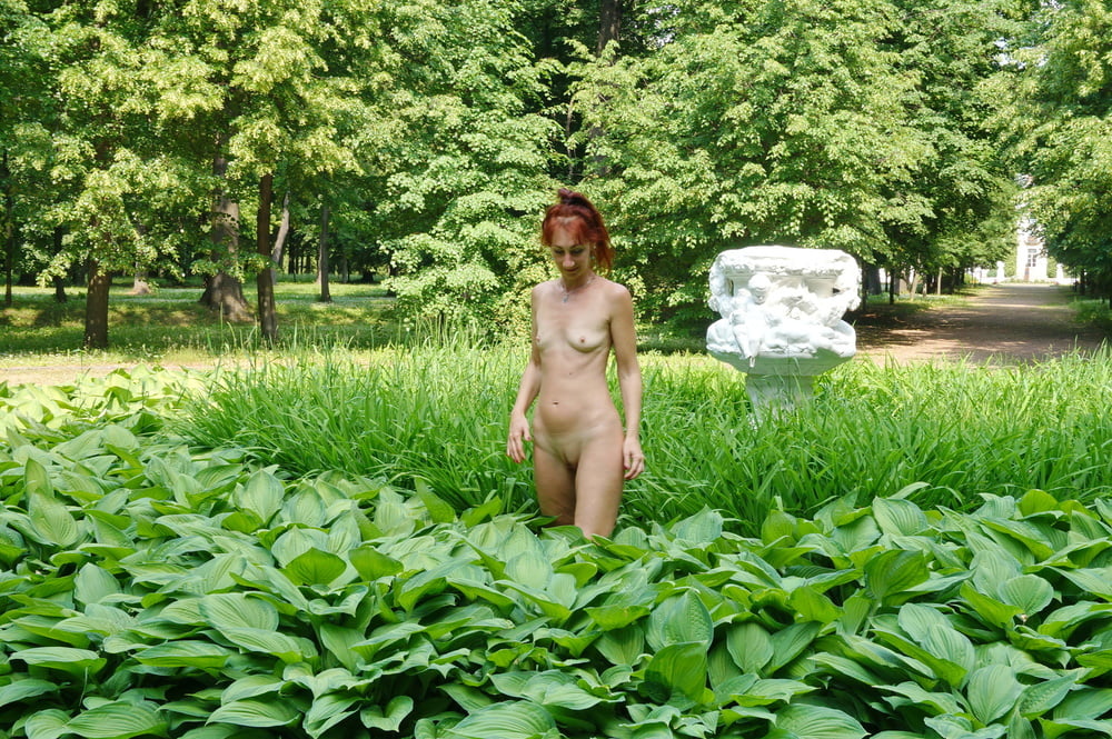 Naked in the grass by the vase #106992958