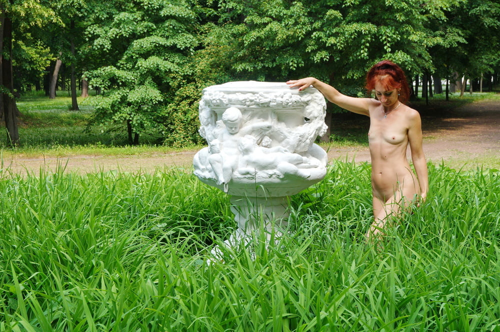 Naked in the grass by the vase #106993008