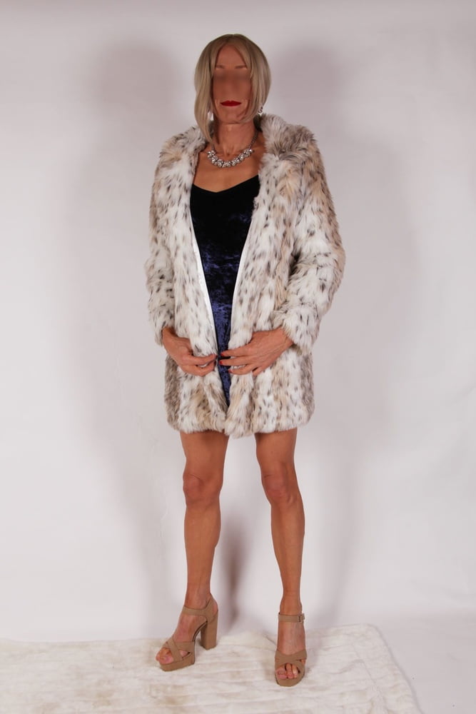 Alessia models slinky velvet blue dress with fur coat #106870818