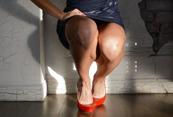 bodybuilder female&#039;s sexy Legs feet and High heels #97106551