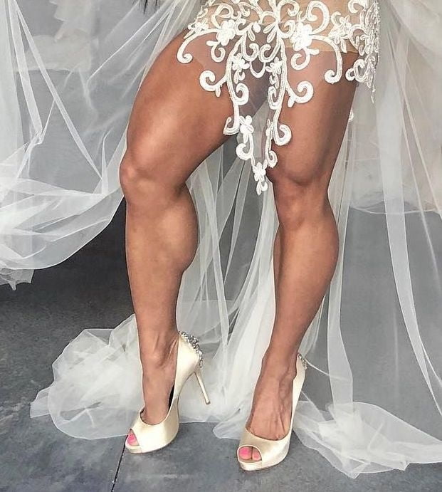 bodybuilder female&#039;s sexy Legs feet and High heels #97106758
