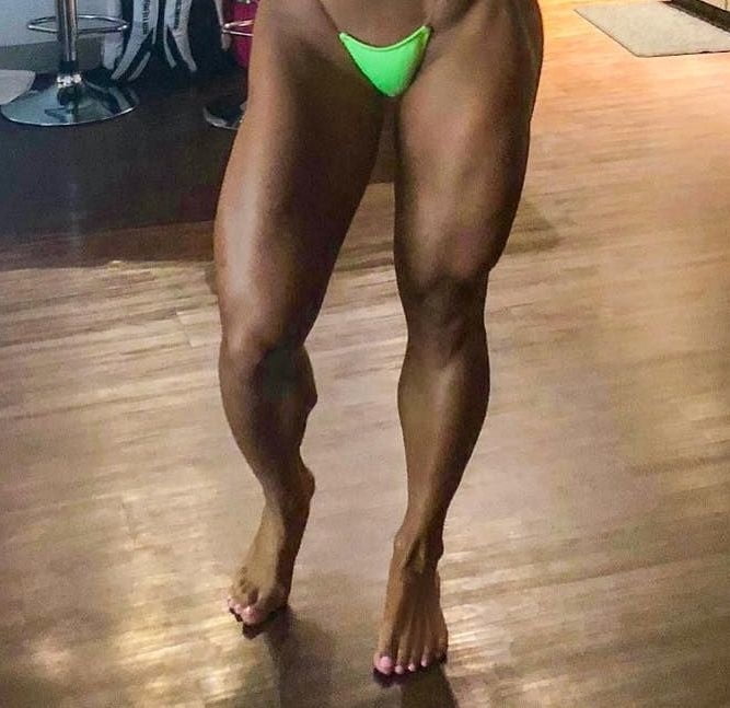 bodybuilder female&#039;s sexy Legs feet and High heels #97106760