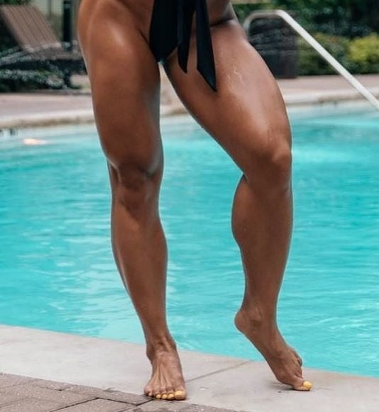 bodybuilder female&#039;s sexy Legs feet and High heels #97106778