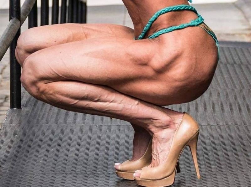 bodybuilder female&#039;s sexy Legs feet and High heels #97106816