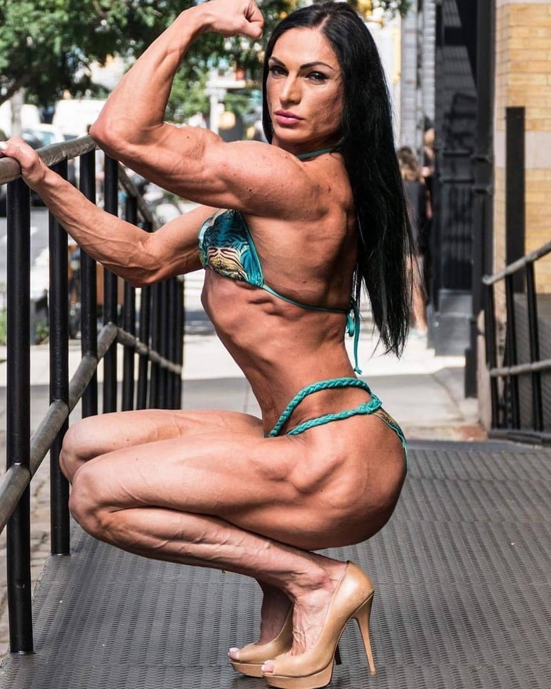 bodybuilder female&#039;s sexy Legs feet and High heels #97106819