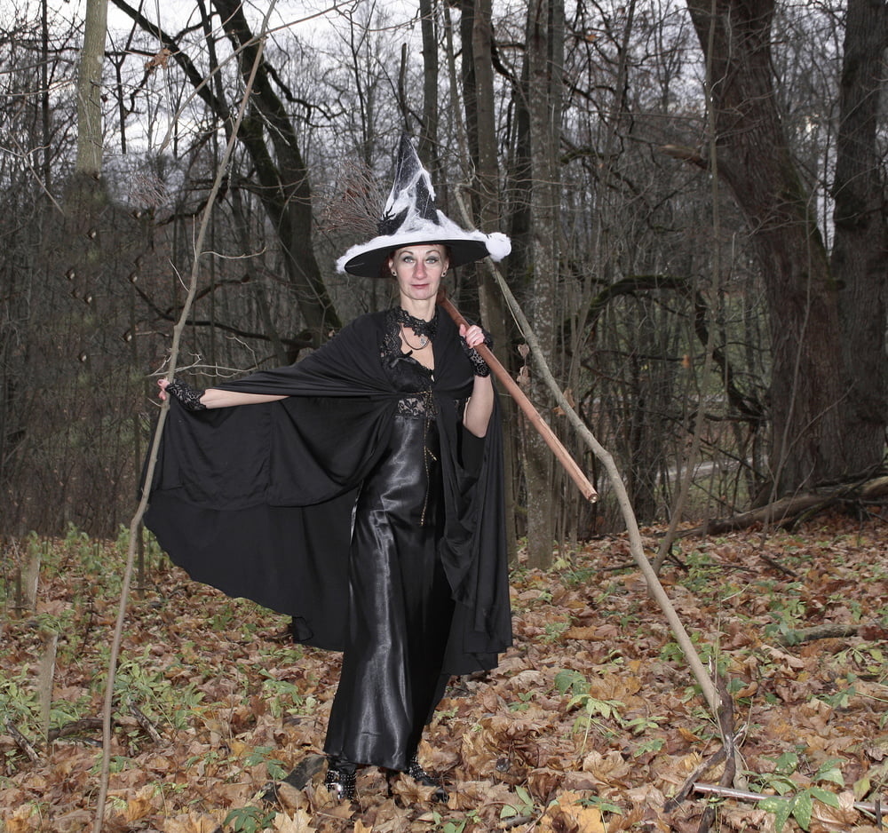 Witch with broom in forest #106868491