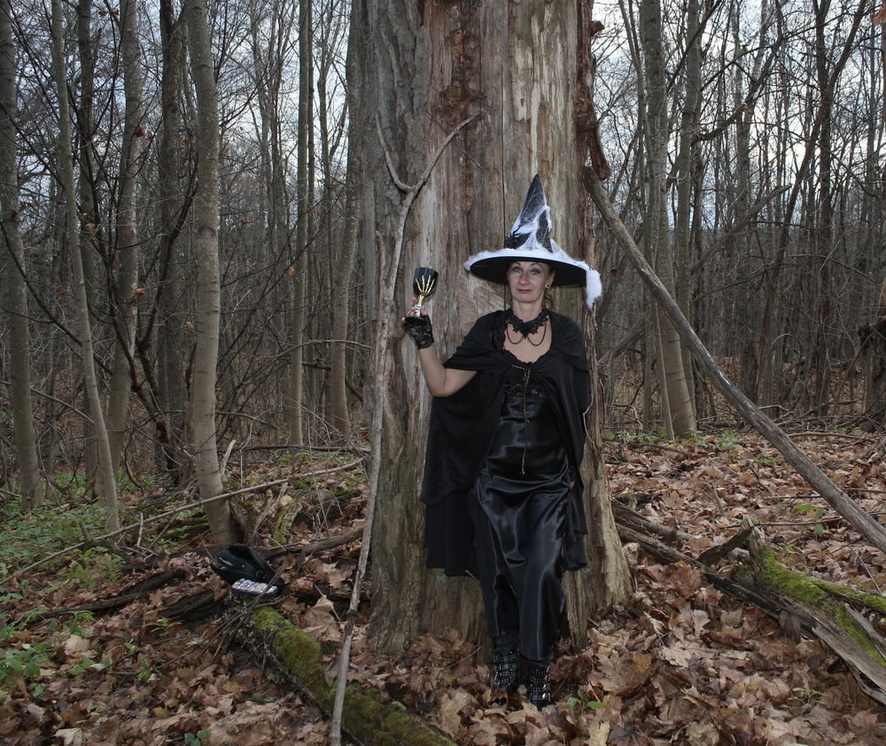 Witch with broom in forest #106868492