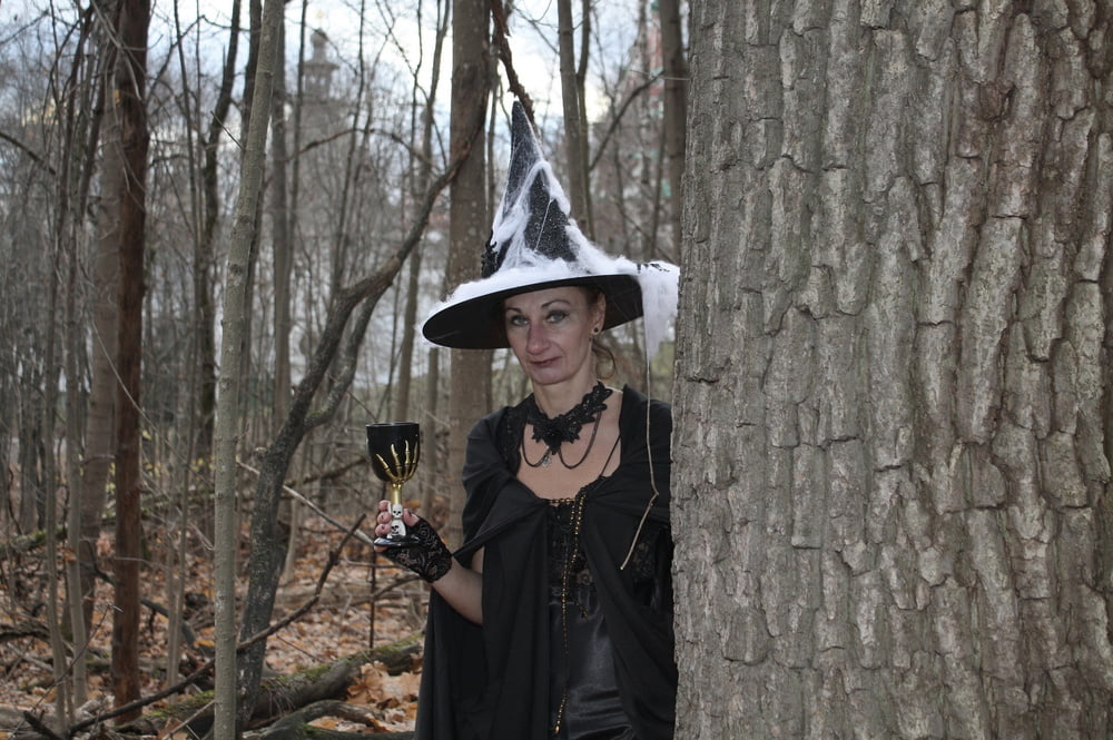 Witch with broom in forest #106868502