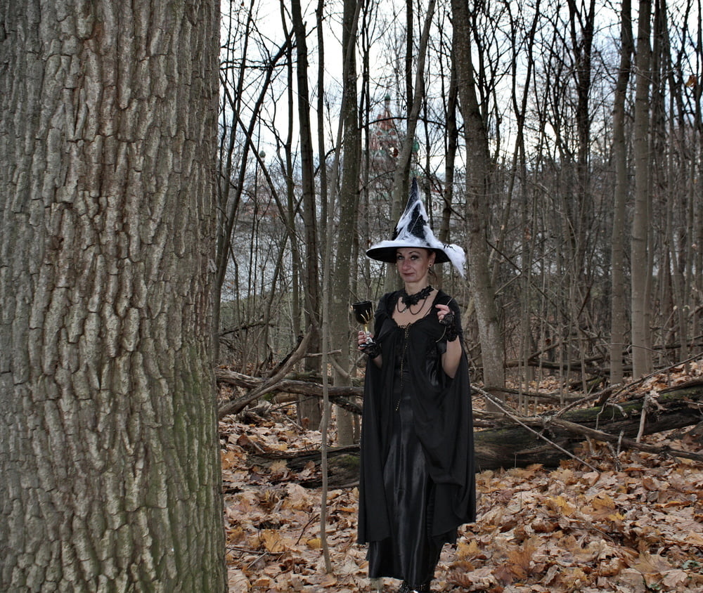 Witch with broom in forest #106868506