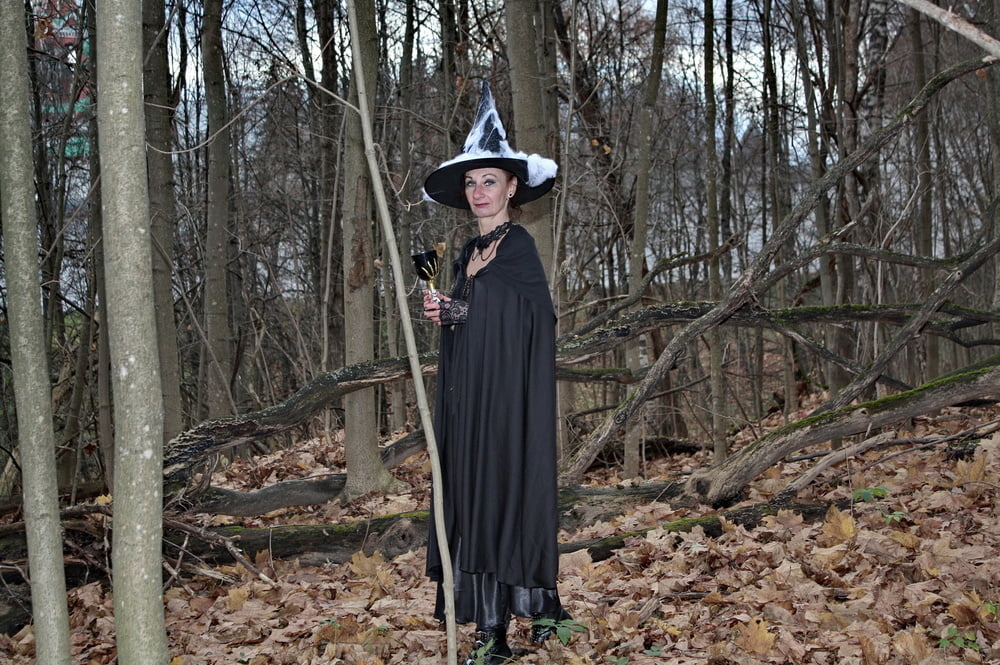 Witch with broom in forest #106868508