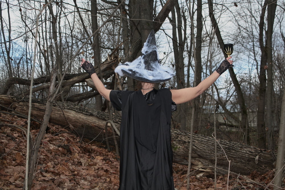 Witch with broom in forest #106868510