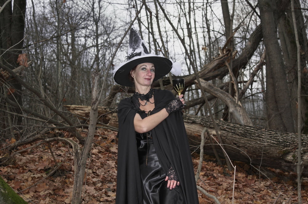 Witch with broom in forest #106868511