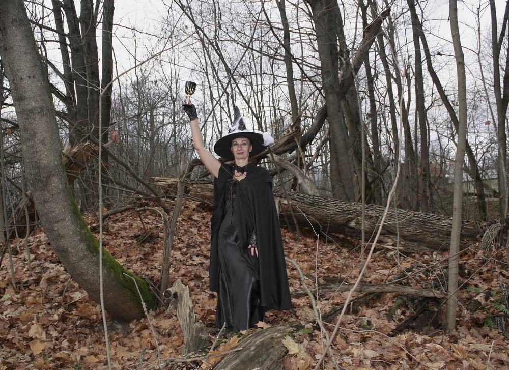 Witch with broom in forest #106868515