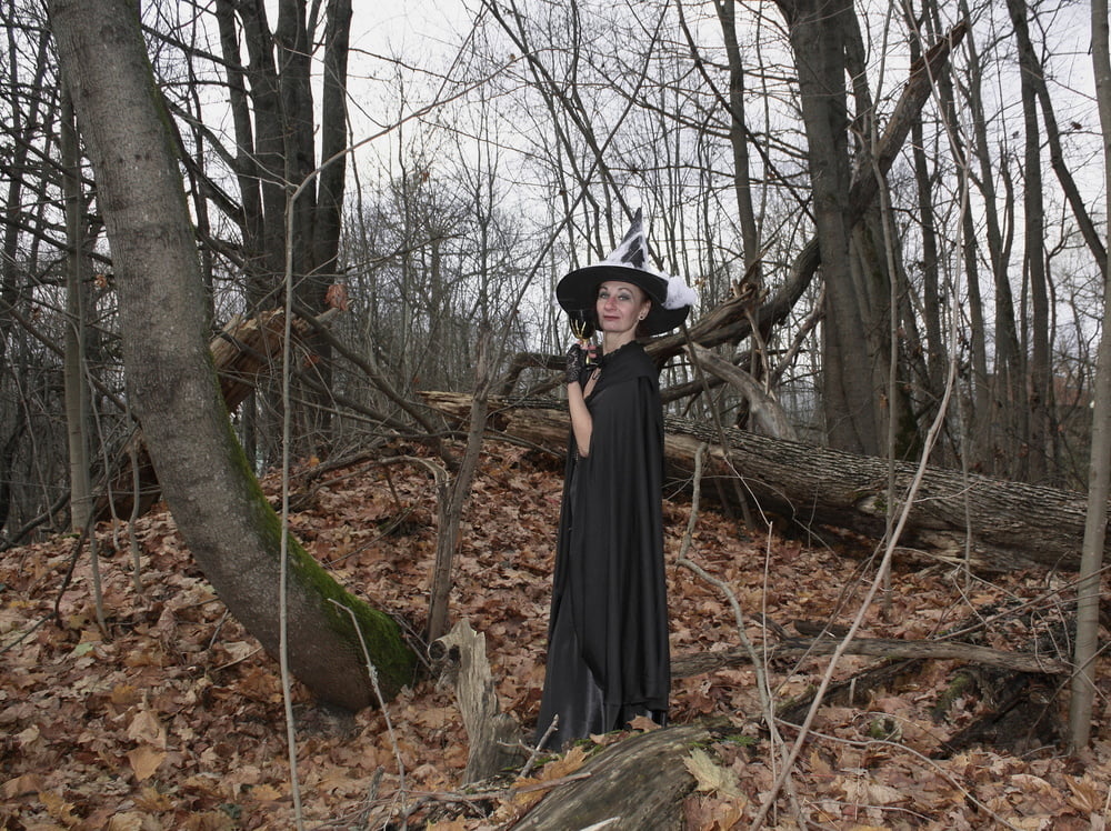 Witch with broom in forest #106868518
