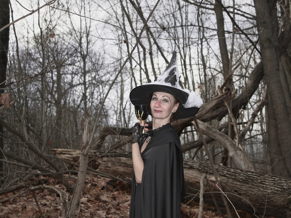 Witch with broom in forest #106868520