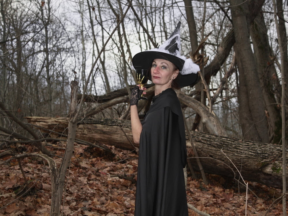 Witch with broom in forest #106868523