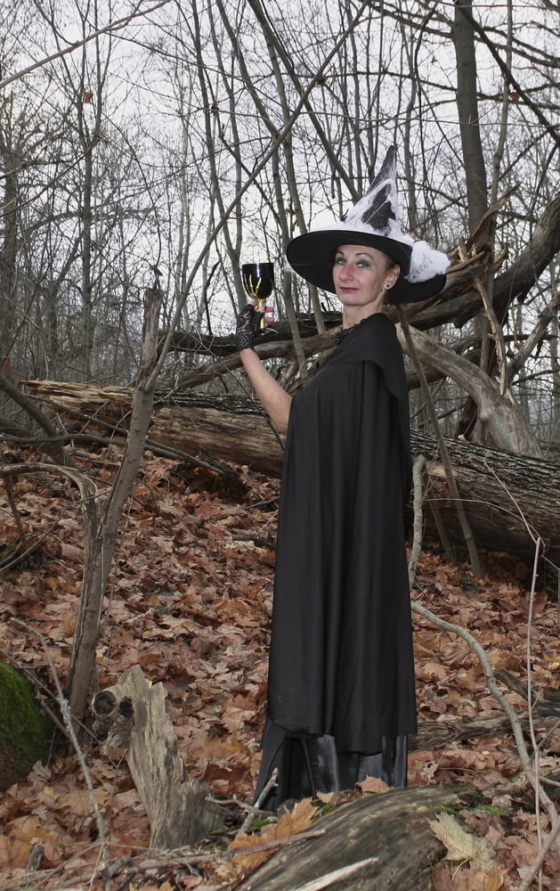 Witch with broom in forest #106868527