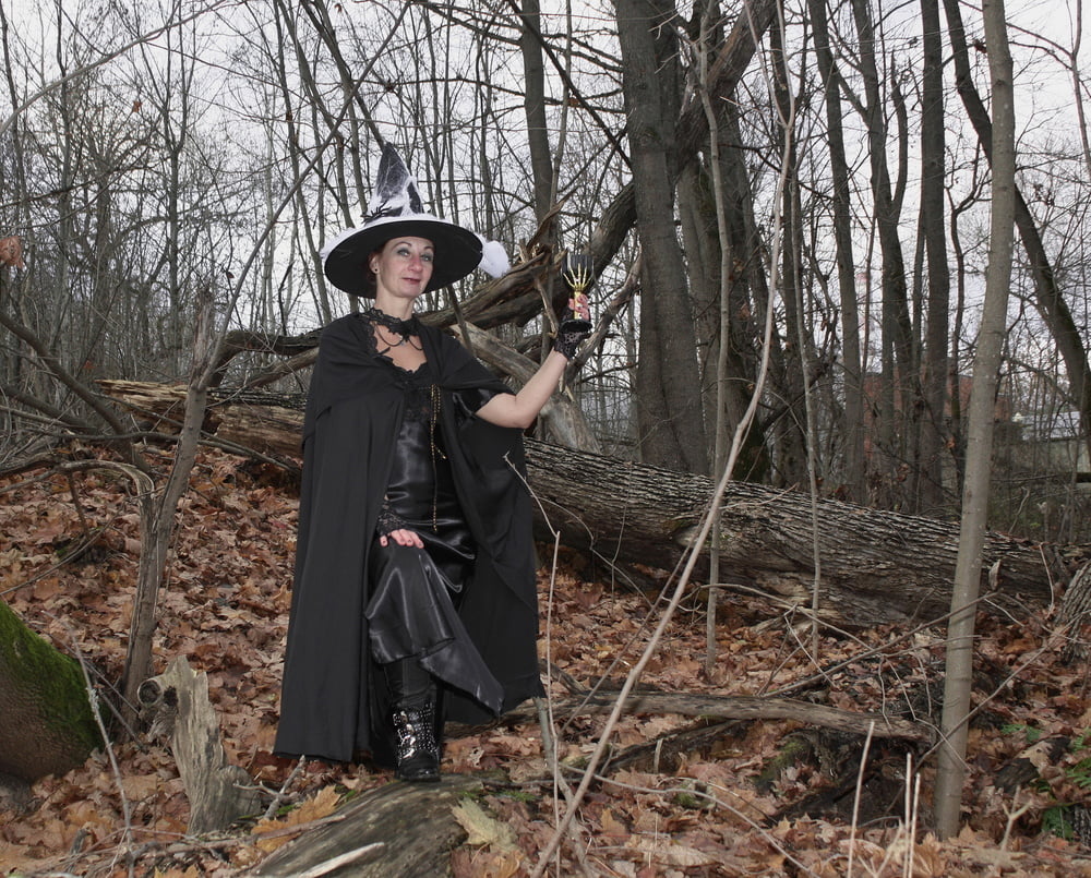 Witch with broom in forest #106868529