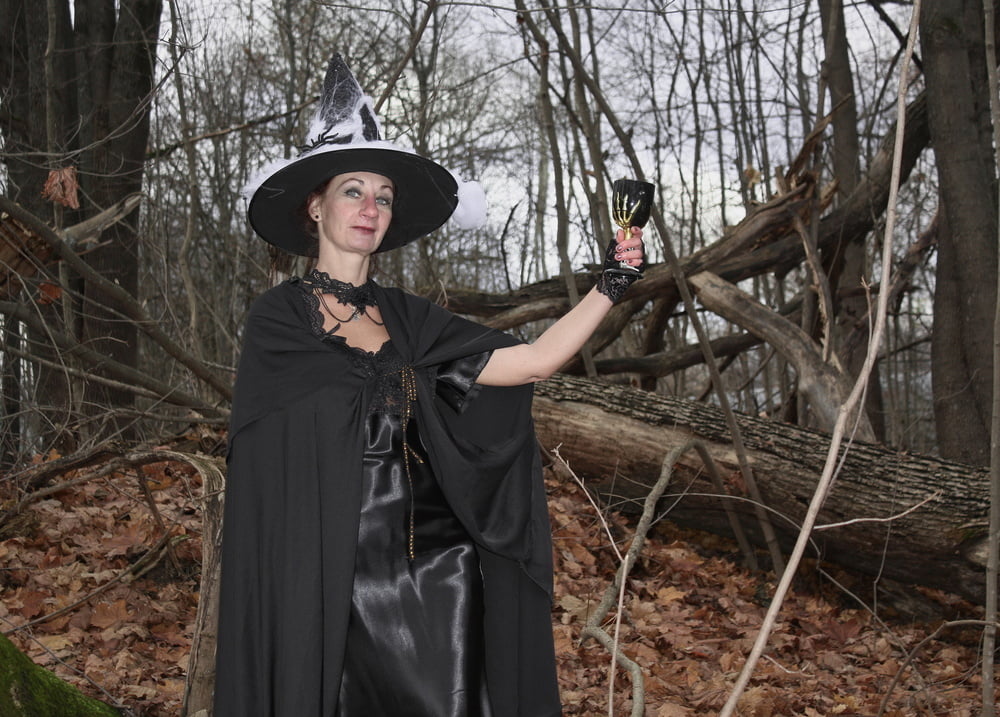 Witch with broom in forest #106868531