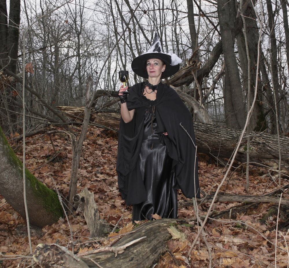 Witch with broom in forest #106868533