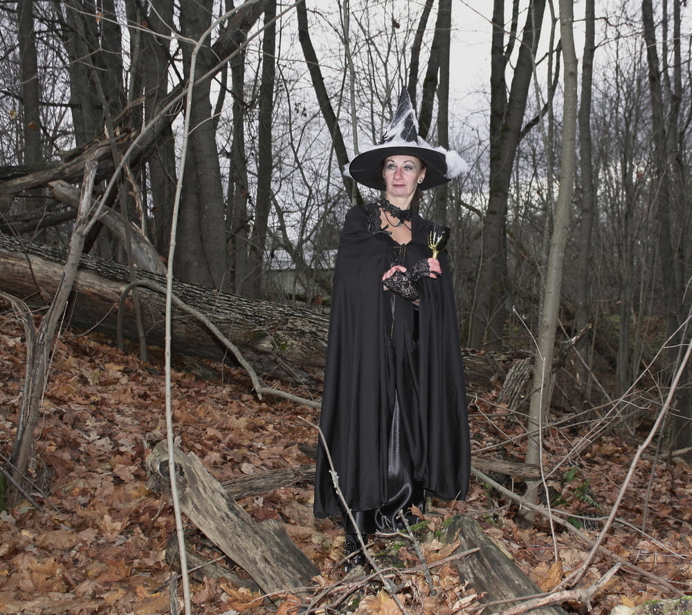 Witch with broom in forest #106868536