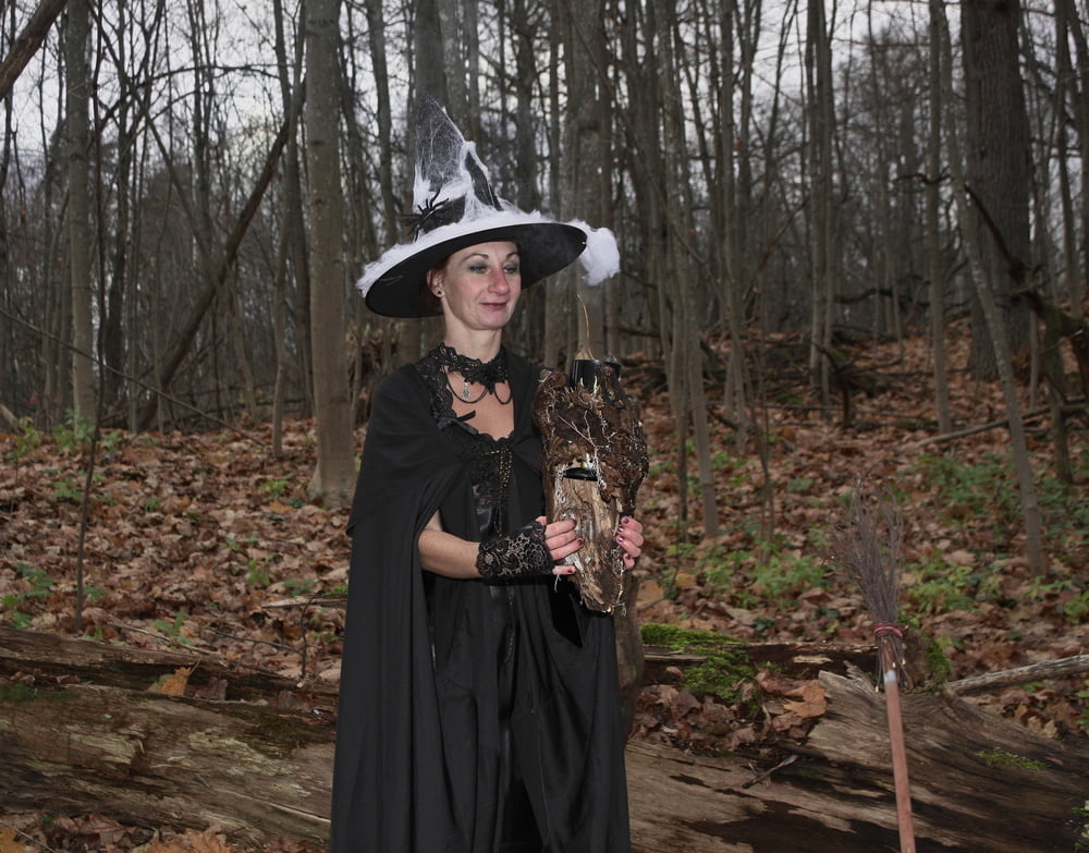 Witch with broom in forest #106868538
