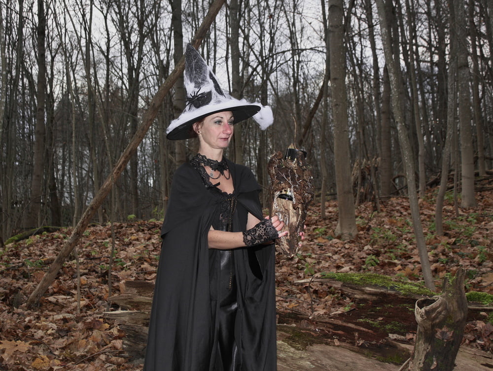 Witch with broom in forest #106868540