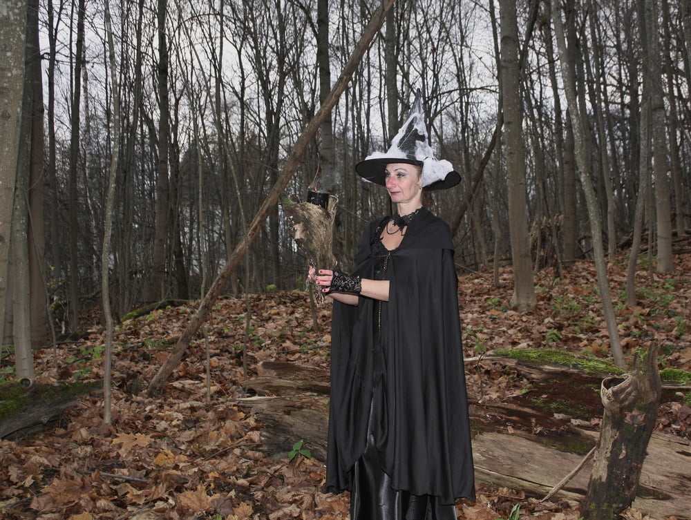 Witch with broom in forest #106868543