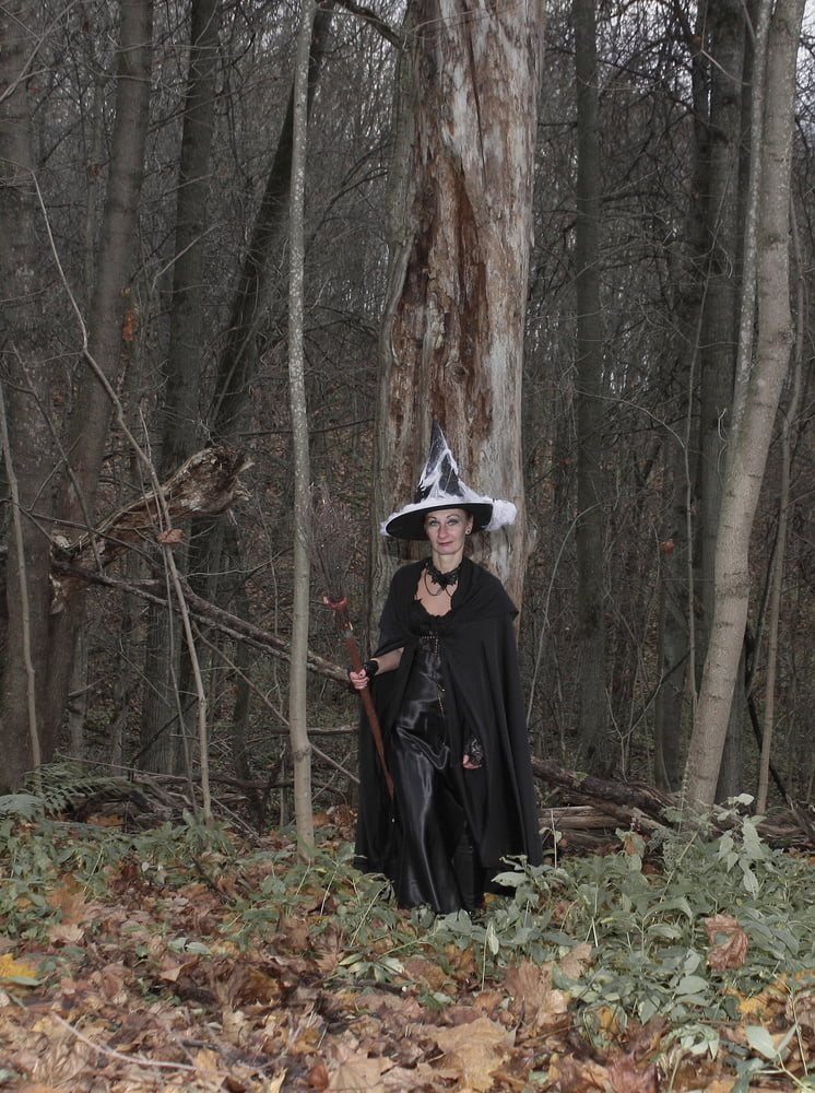 Witch with broom in forest #106868546
