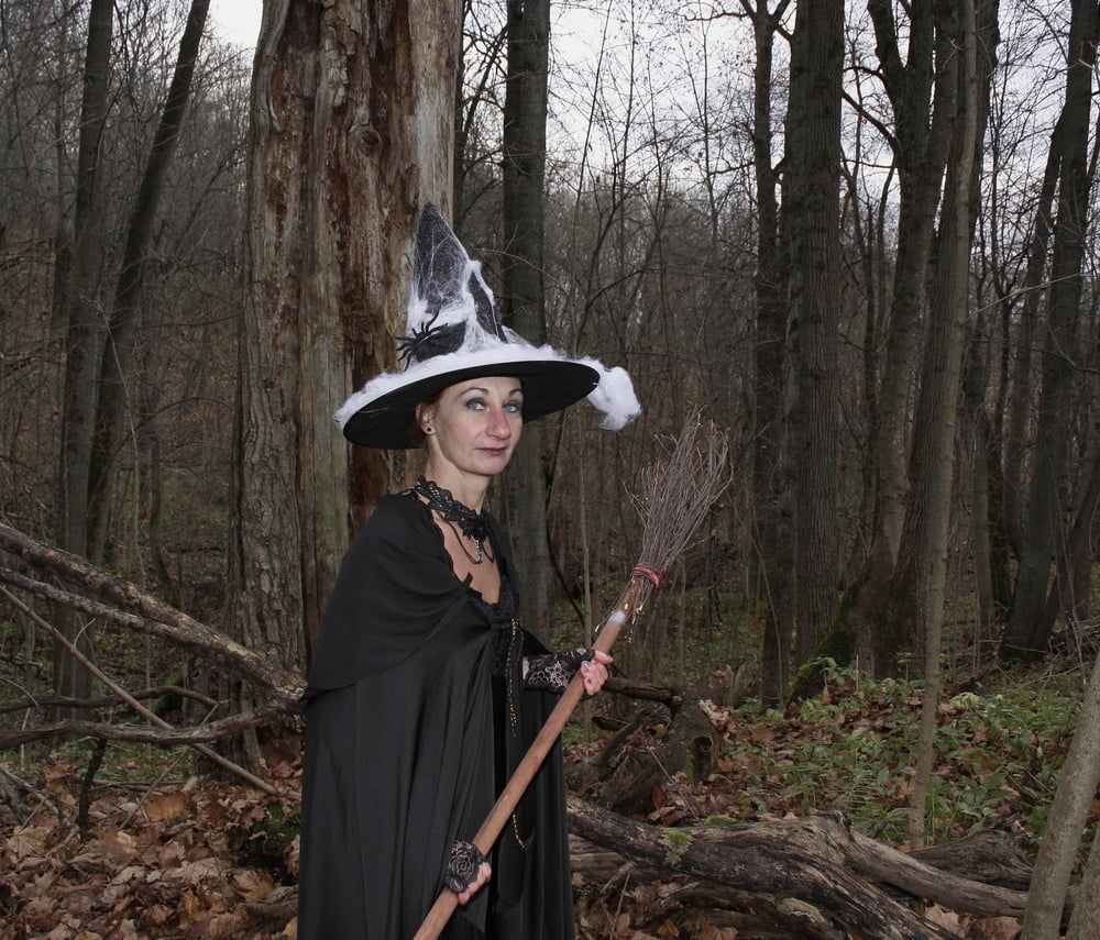 Witch with broom in forest #106868552