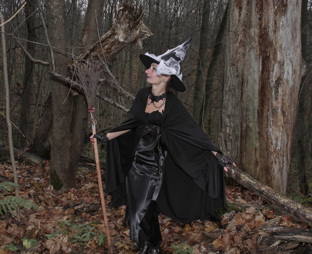 Witch with broom in forest #106868560