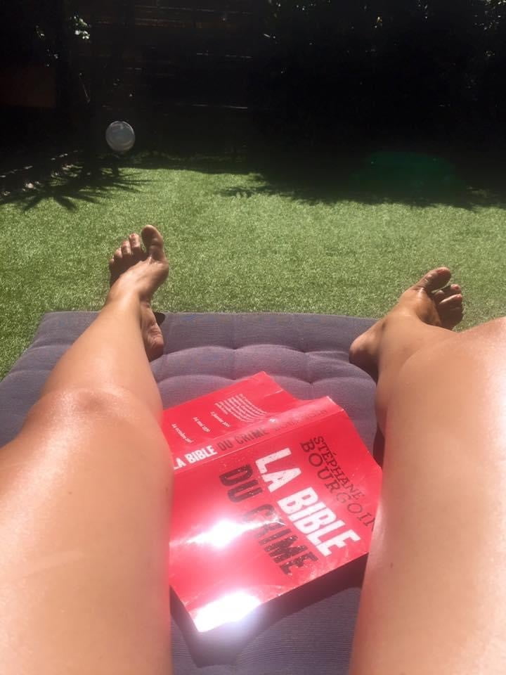 Legs and feet of a pretty reader #99057385