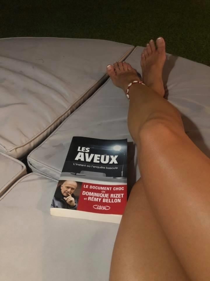 Legs and feet of a pretty reader #99057403