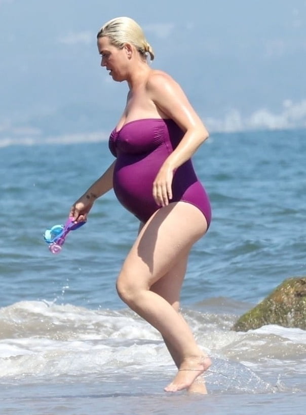 Katy Perry pregnant in a purple swimsuit #90400590