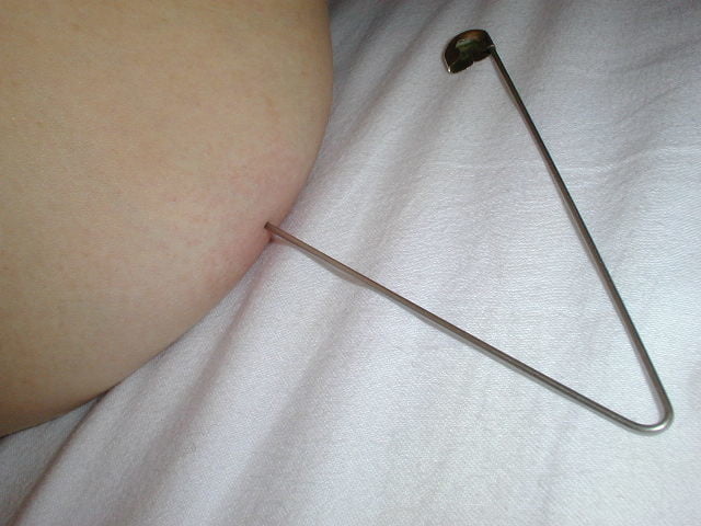 needles in tits, safety pins... #87881800