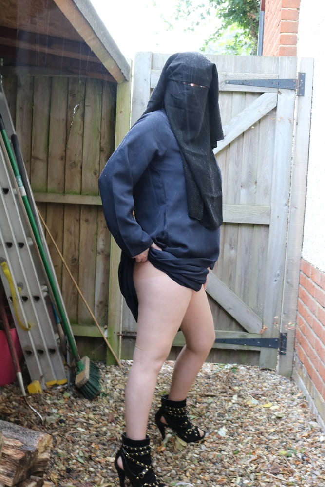 Burqa Outdoors Flashing in the Rain #106932251