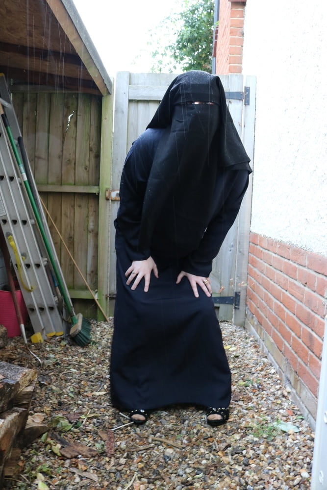 Burqa Outdoors Flashing in the Rain #106932257