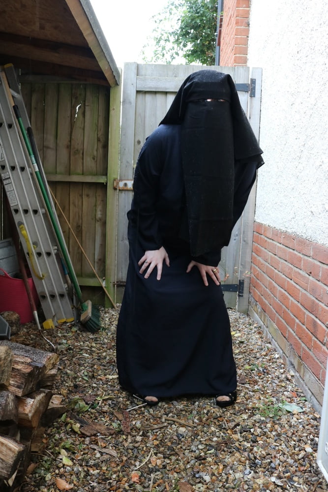 Burqa Outdoors Flashing in the Rain #106932258